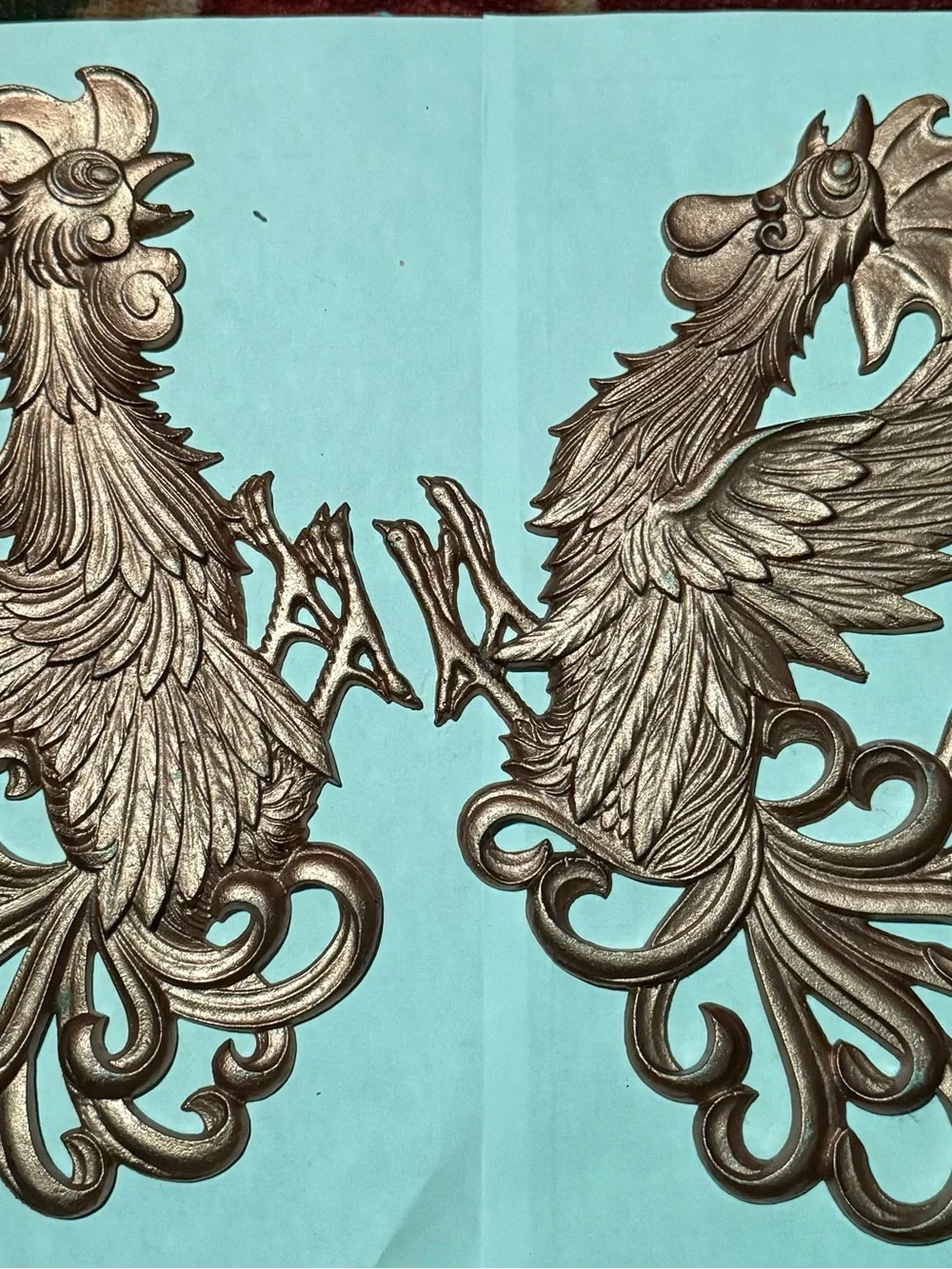 Vintage gold-painted aluminum or brass fighting rooster wall plaques
